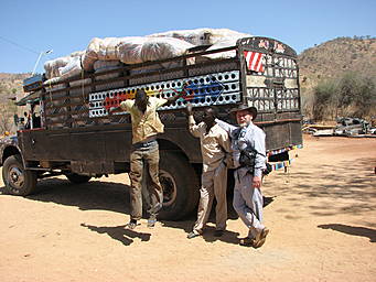 View larger image truck loaded with bales of blankets