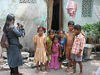 View larger image Gracey photographing children