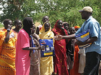 View larger image man handing packages to women