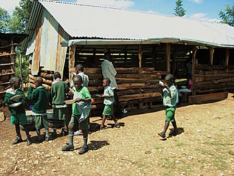 View larger image children carrying dishes