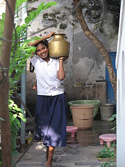 View larger image girl carrying water