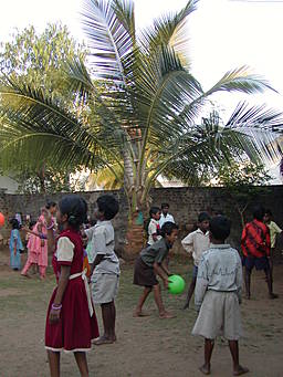View larger image Children playing at CCIMA home